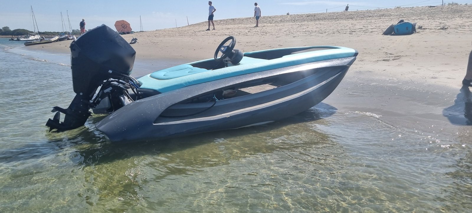 The Drift 340 drawn up on a beach